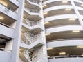 Walking stair on the side of a white multi storey parking lots building