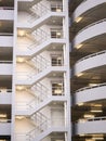 Walking stair on the side of a white multi storey parking lots building