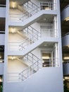 Walking stair on the side of a white multi storey parking lots building Royalty Free Stock Photo