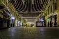 Walking street with Christmas lights during the night - December 6th, 2015 in downtown medieval city of Brasov, Romania Royalty Free Stock Photo