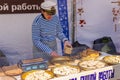 Kaliningrad, Russia - April 13, 2019: Woman cooking sweets on holiday of herring day