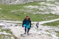 Walking summer trekking in the Dolomites. People in the mountains. Mountain view Italian Alps.