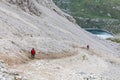 Walking summer trekking in the Dolomites. People in the mountains. Mountain view Italian Alps.