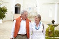 Walking, talking and a senior couple in the city for a retirement holiday, travel and happiness. Smile, love and an Royalty Free Stock Photo