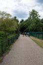 Walking throw finsbury Park. Lovely grey cloudy sky above.