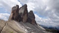 Walking to the peaks of Drei Zinnen, Tre Cime di Lavaredo in Dolomiten mountains, Italy Royalty Free Stock Photo