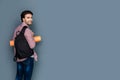 Joyful handsome man wearing rucksack Royalty Free Stock Photo