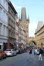 The walking tourists pass through an acre and come to Karlov Bridge. Royalty Free Stock Photo