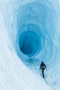 Walking toward an ice cave with deep blue ice  on the Matanuska Glacier in Alaska Royalty Free Stock Photo