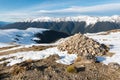 walking track with stone cairn and melting snow in Nelson Lakes National Park, New Zealand Royalty Free Stock Photo