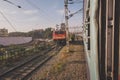 Walking between tracks with trains in india Royalty Free Stock Photo