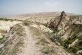 Walking trail through beautiful inspiring scenic panoramic stone mountain landscape view of red valley with sky background