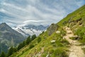 Walking trail from Kreuzboden to Saas-Almagell with incredible views on always white Alps above the Saas-Fee village in