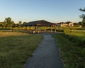 this walking trail leads to a pavilion are ready for the days visitors Royalty Free Stock Photo
