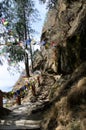 Walking trail to Paro Taktsang Tiger Nest`s Monastery with Tibetan prayer flags, upper Paro Valley, Bhutan Royalty Free Stock Photo