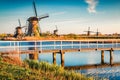 Walking very early, you will not find anyone in Kinderdijk museum. Colorful outdoor scene of Netherlands with famous Dutch windmil Royalty Free Stock Photo