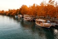 Walking vintage boats on the lake. Autumn location. Turkey, Manavgat