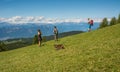 Walking walkers admire the Dolomite mountains landscape..South Tyrol, Italy