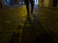 walking on wet parquets after rain and light colors reflected on cobblestones