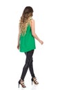 Walking Woman In Leather Trousers And High Heels. Rear Side View. Royalty Free Stock Photo