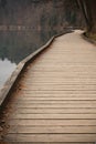 Walking on wooden pathway around wonderful lake bled breathing fresh alpine air Royalty Free Stock Photo