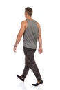 Walking Young Man In Camo Pants Rear View