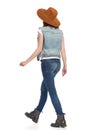 Walking Young Woman In Brown Suede Hat. Side Rear View. Royalty Free Stock Photo