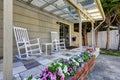 Walkout patio area with white rocking chairs