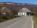 An autumn day, a mountain chalet, a sunny morning, the life of wooden structures, residential buildings falling into disrepair.