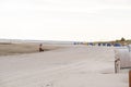 Walks and rest on the Wadden Sea.Beach wicker boxes set on white sand.Fer Island.Germany.North Sea.Beach box on the sea Royalty Free Stock Photo