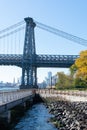 Walkway along the East River Park by the Williamsburg Bridge on the Lower East Side of New York City during Autumn