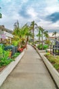 Walkway along homes and canal in the scenic resort like community of Long Beach