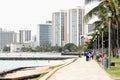 Walkway along Kuhio Beach looking toward Waikiki shops and hotels