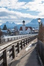 Walkway along the road with view to wallgau church and village Royalty Free Stock Photo