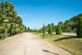 Walkway in beautiful tropical garden landscape in nature city park in summer season sunny day with blue sky white clouds. Royalty Free Stock Photo