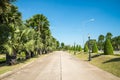 Walkway in beautiful tropical garden landscape in nature city park in summer season sunny day with blue sky white clouds. Royalty Free Stock Photo