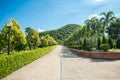 Walkway in beautiful tropical garden landscape in nature city park in summer season sunny day with blue sky white clouds. Royalty Free Stock Photo