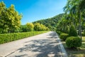 Walkway in beautiful tropical garden landscape in nature city park in summer season sunny day with blue sky white clouds. Royalty Free Stock Photo