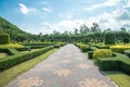 Walkway in beautiful tropical garden landscape in nature city park in summer season sunny day with blue sky white clouds. Royalty Free Stock Photo