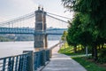 Walkway and the John A. Roebling Suspension Bridge, seen at Smale Riverfront Park, in Cincinnati, Ohio Royalty Free Stock Photo