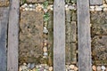 Walkway made old wood and stone on the grass