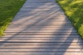 Walkway made of wooden planks. Summer season Royalty Free Stock Photo