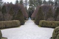 A walkway through manicured gardens the Mount