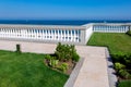 Walkway of marble tiles and stone balustrades.