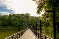 The walkway over the river heading into the park