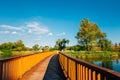 Walkway with pond and green trees at Baramsae Village Picnic Garden in Pyeongtaek, Korea