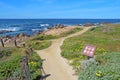 Walkway and sign for Asilomar State beach in Pacific Grove, Cali