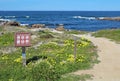 Walkway and sign for Asilomar State beach in Pacific Grove, Cali