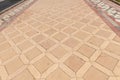 Walkway with square stone tiles Royalty Free Stock Photo