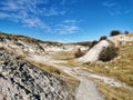 A walkway through white sandstone formations at St Bathans in New Zealand